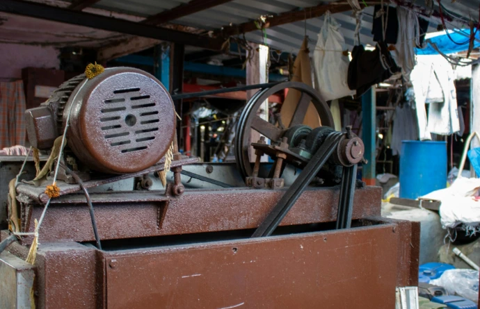 Old industrial machine with motor and pulley system